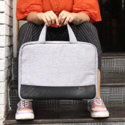 Girl holding a denim laptop bag